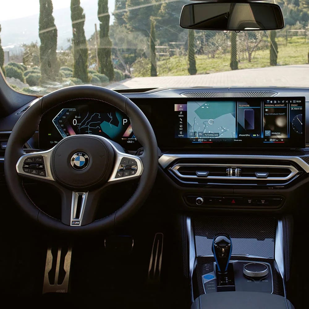 A driver's eye view of steering wheel and controls of the BMW i4 | BMW of Spokane in Spokane WA