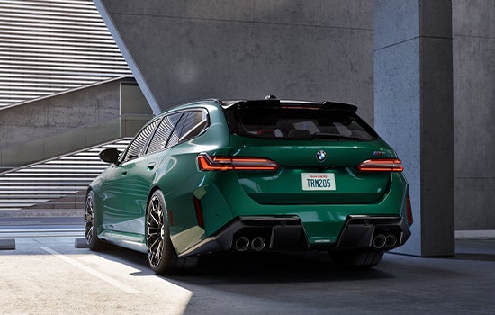 Green BMW M5 Touring parked in garage. | BMW of Spokane in Spokane WA