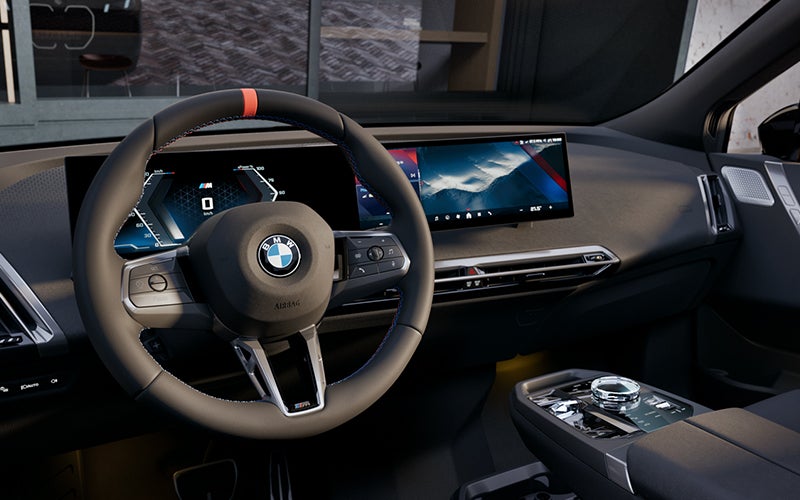 Interior steering wheel and dashboard of the BMW iX M70. | BMW of Spokane in Spokane WA