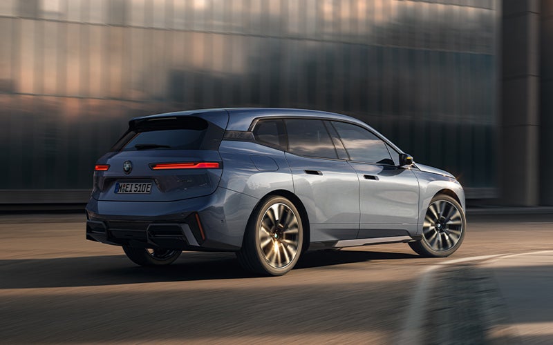 The BMW iX driving with the front wheel turned. | BMW of Spokane in Spokane WA