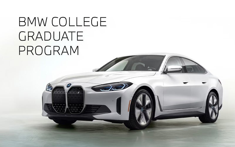White BMW i4 parked. BMW College Graduate Program. | BMW of Spokane in Spokane WA
