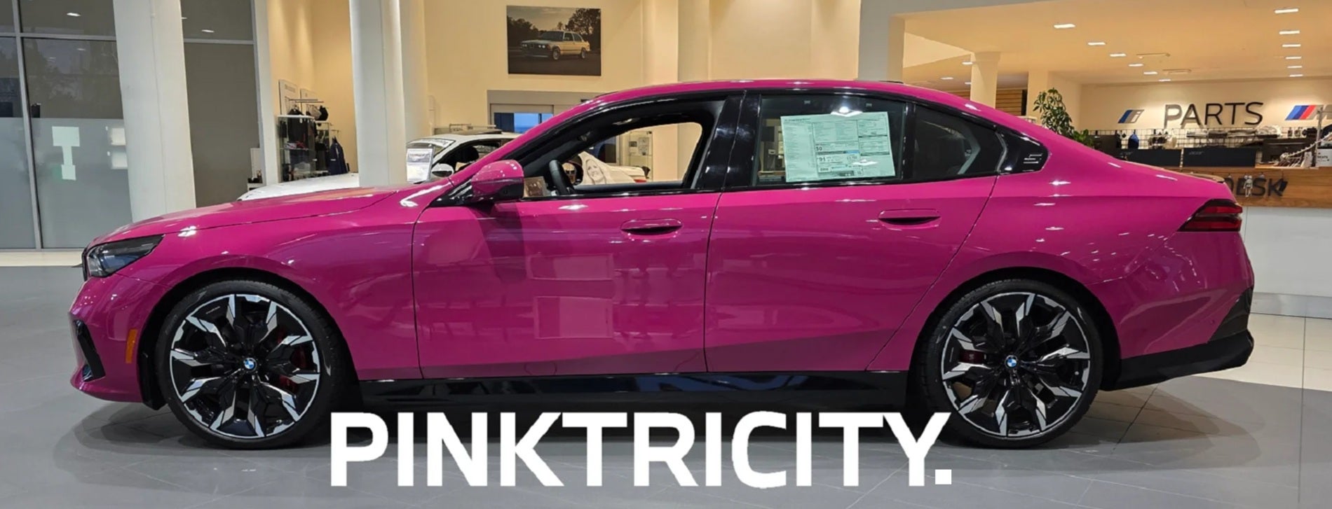 THE BMW i5 IN RUBY STAR NEO